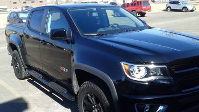 Westin Pro Traxx 4 inch ovals and a BAK Flip tonneau cover on a Chevy Colorado