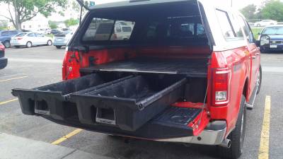 A Decked storage drawer system in a Ford F150