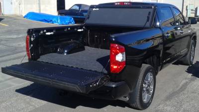 BAK Flip MX4 and a BedRug bed mat in a Toyota Tundra